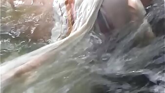 unconcerned couple fucking bareback in water